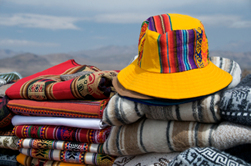 Alpaca Hat and Blankets displaying Andean colors
